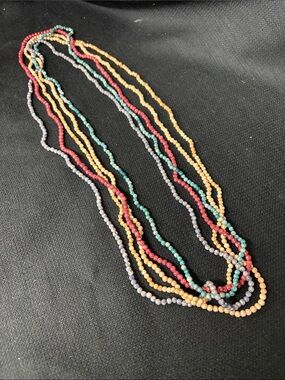 Multiple stone bead necklaces in Red, Teal, blue and tan